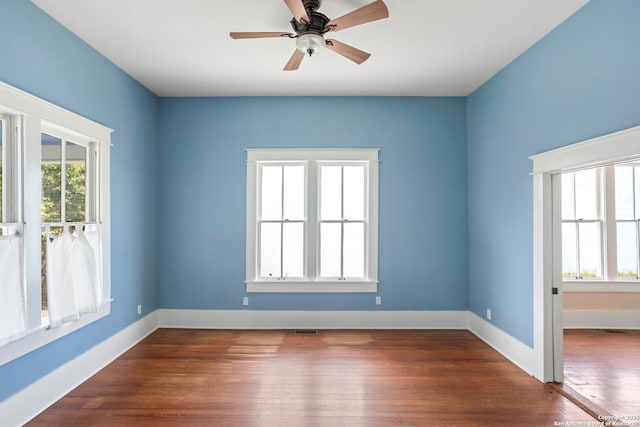 110 Vitra, San Antonio, TX 78210 - unfurnished room featuring dark wood-style floors and ceiling fan