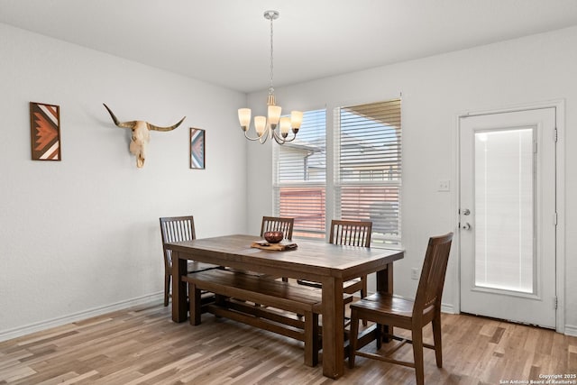6583 Runaway, Converse, TX 78109 - dining room featuring light wood-style flooring and a chandelier