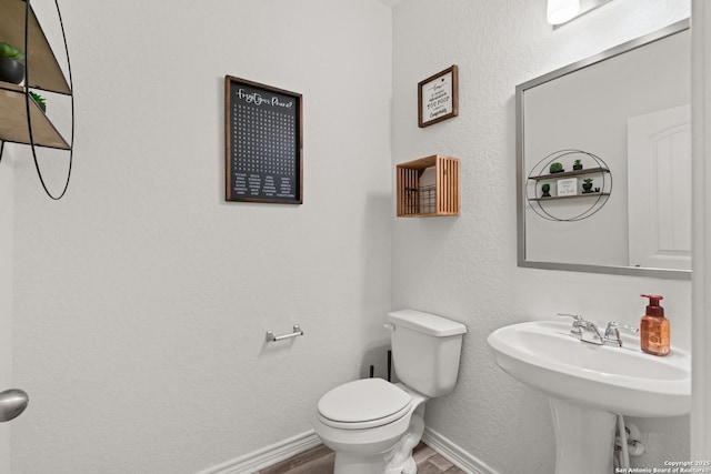 6583 Runaway, Converse, TX 78109 - half bathroom with wood finished floors and toilet