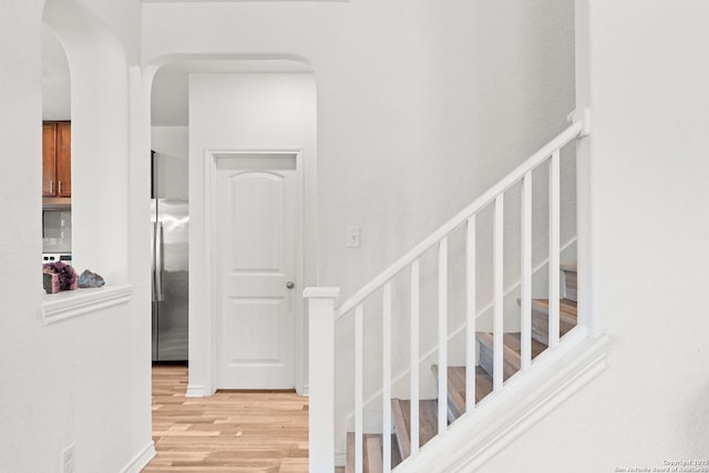 6583 Runaway, Converse, TX 78109 - stairs featuring wood finished floors and arched walkways