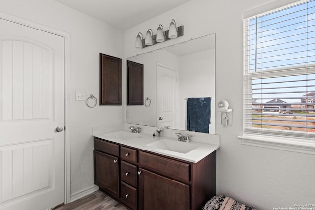 6583 Runaway, Converse, TX 78109 - bathroom featuring double vanity and wood finished floors
