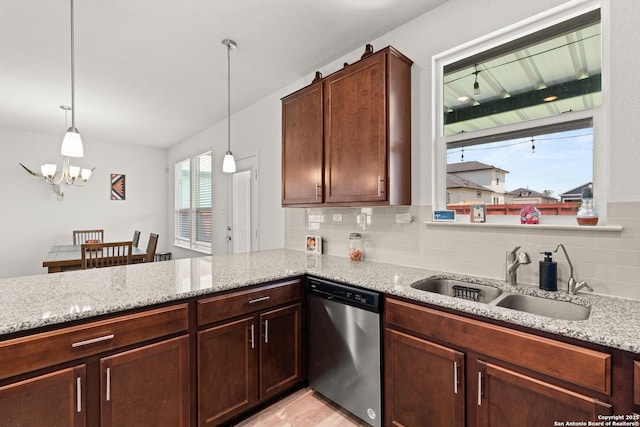 6583 Runaway, Converse, TX 78109 - kitchen featuring dishwasher, light stone countertops, decorative backsplash, a chandelier, and a peninsula