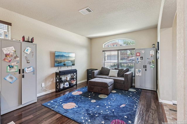630 Oxalis, San Antonio, TX 78260 - living room featuring wood finished floors and a textured ceiling