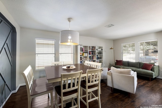7907 Oakwood Pnes, San Antonio, TX 78254 - dining area featuring dark wood finished floors and baseboards