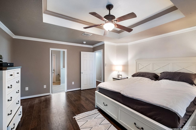 7907 Oakwood Pnes, San Antonio, TX 78254 - bedroom featuring a raised ceiling, dark wood-style floors, crown molding, connected bathroom, and a ceiling fan