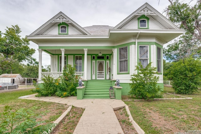 9248 Fm 725, Mcqueeney, TX 78123 - victorian house with covered porch and a front yard