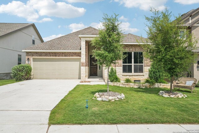 1533 Cawdon Park, Bulverde, TX 78163 - view of front of property featuring an attached garage, stone siding, a shingled roof, and driveway