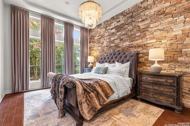 22715 Colibries, San Antonio, TX 78261 - bedroom with a chandelier and wood finished floors