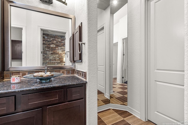 22715 Colibries, San Antonio, TX 78261 - bathroom with a textured wall and vanity
