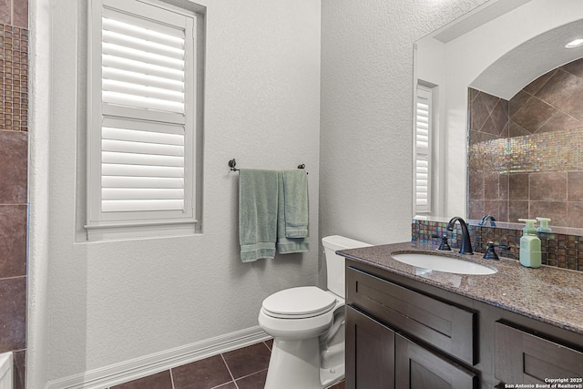 22715 Colibries, San Antonio, TX 78261 - full bathroom featuring vanity, tile patterned flooring, a textured wall, and a shower