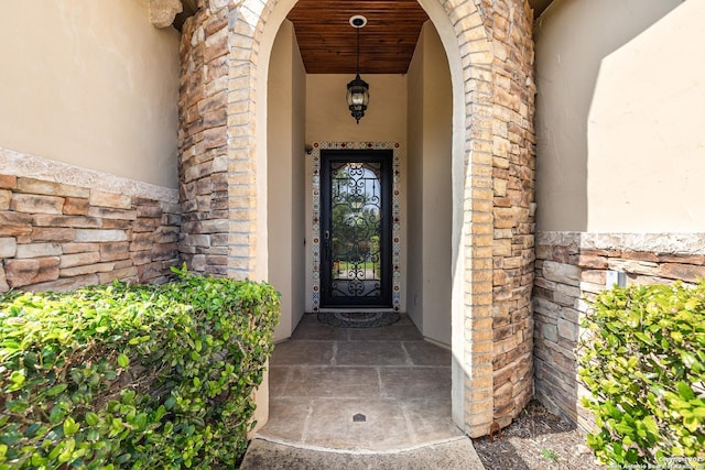 22715 Colibries, San Antonio, TX 78261 - doorway to property with stucco siding and stone siding