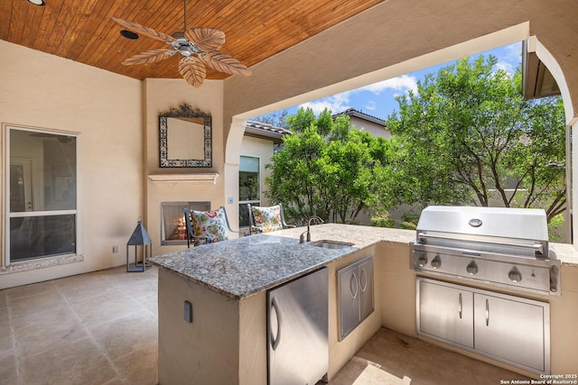 22715 Colibries, San Antonio, TX 78261 - view of patio with an outdoor kitchen and a ceiling fan