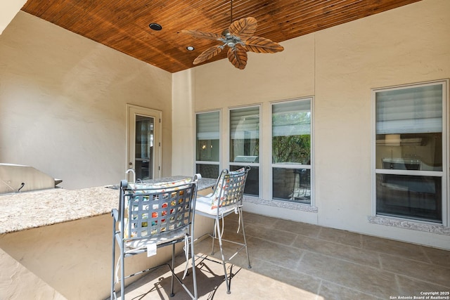 22715 Colibries, San Antonio, TX 78261 - view of patio / terrace with outdoor dining area, exterior kitchen, and ceiling fan