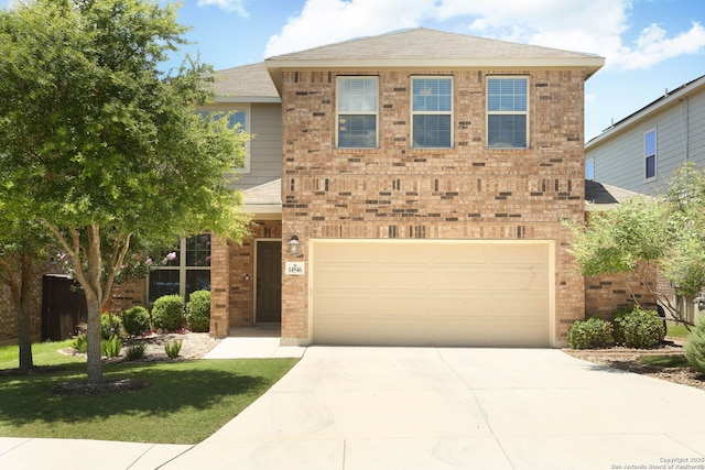 14946 Costa Leon, San Antonio, TX 78245 - view of front facade featuring an attached garage, driveway, brick siding, a front yard, and roof with shingles