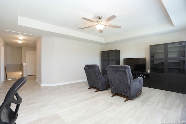 14946 Costa Leon, San Antonio, TX 78245 - living area featuring a tray ceiling, light wood-type flooring, ceiling fan, attic access, and an office area