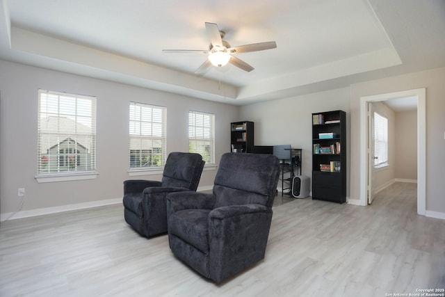 14946 Costa Leon, San Antonio, TX 78245 - sitting room with a tray ceiling, ceiling fan, and light wood-style floors
