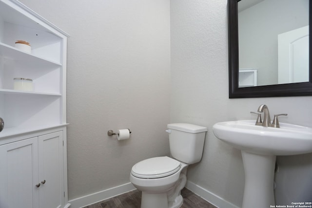 14946 Costa Leon, San Antonio, TX 78245 - bathroom with wood finished floors and baseboards