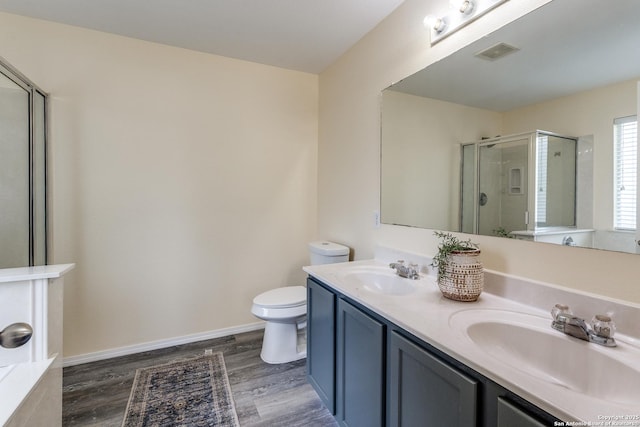 109 Bay Willow, Cibolo, TX 78108 - bathroom featuring wood finished floors, double vanity, and a shower stall