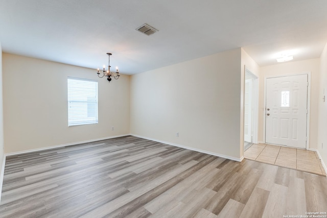109 Bay Willow, Cibolo, TX 78108 - spare room with a chandelier and light wood finished floors