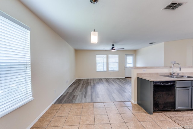 109 Bay Willow, Cibolo, TX 78108 - kitchen with black dishwasher, ceiling fan, light countertops, gray cabinetry, and hanging light fixtures