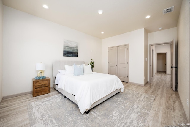 326 Cactus, San Antonio, TX 78203 - bedroom with light wood-type flooring, a closet, and recessed lighting