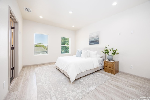 326 Cactus, San Antonio, TX 78203 - bedroom with light wood-type flooring and recessed lighting