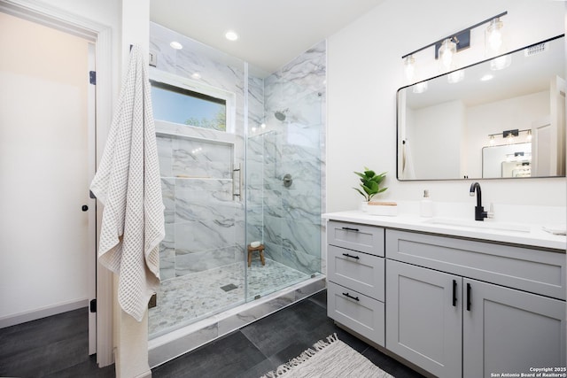 326 Cactus, San Antonio, TX 78203 - full bath with a marble finish shower, vanity, wood finished floors, and recessed lighting