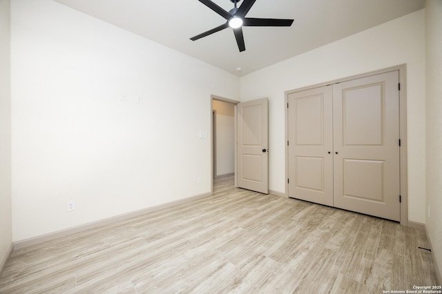 326 Cactus, San Antonio, TX 78203 - unfurnished bedroom with wood finished floors, a closet, and a ceiling fan