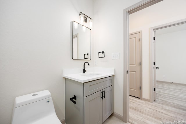326 Cactus, San Antonio, TX 78203 - half bath featuring vanity and wood finished floors