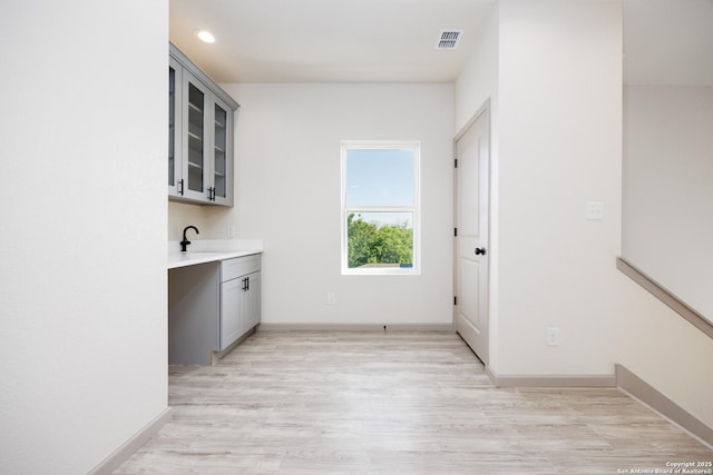 326 Cactus, San Antonio, TX 78203 - washroom with light wood-style flooring and recessed lighting