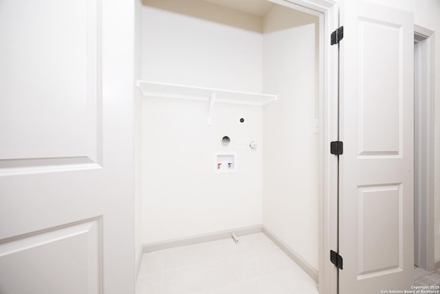 326 Cactus, San Antonio, TX 78203 - laundry area with hookup for a gas dryer, washer hookup, light tile patterned flooring, and electric dryer hookup