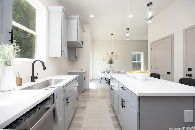 326 Cactus, San Antonio, TX 78203 - kitchen featuring dishwasher, a kitchen island, a chandelier, light countertops, and recessed lighting