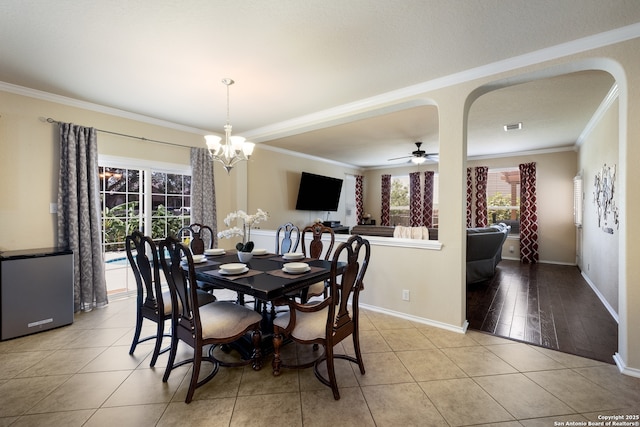 280 Tufted, San Antonio, TX 78253 - dining area featuring crown molding, a chandelier, light tile patterned floors, and a ceiling fan