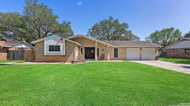 1703 Redwood, Seguin, TX 78155 - single story home featuring brick siding, an attached garage, and concrete driveway