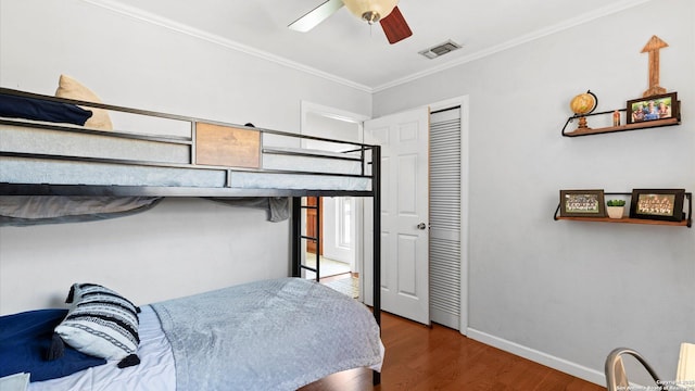 1703 Redwood, Seguin, TX 78155 - bedroom featuring wood finished floors, crown molding, and a ceiling fan