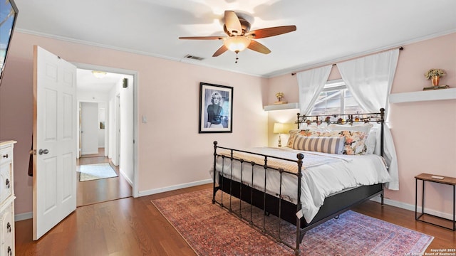1703 Redwood, Seguin, TX 78155 - bedroom featuring wood finished floors, crown molding, and ceiling fan