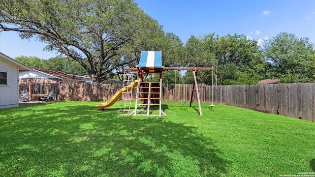 1703 Redwood, Seguin, TX 78155 - view of playground with a fenced backyard