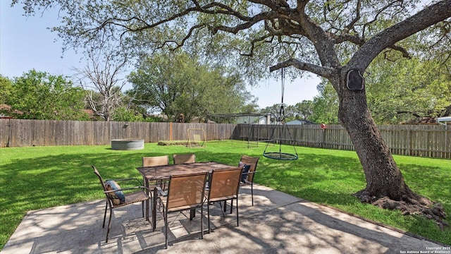 1703 Redwood, Seguin, TX 78155 - fenced backyard featuring a patio area and outdoor dining space