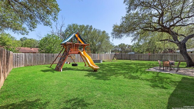 1703 Redwood, Seguin, TX 78155 - view of jungle gym featuring a fenced backyard and a patio