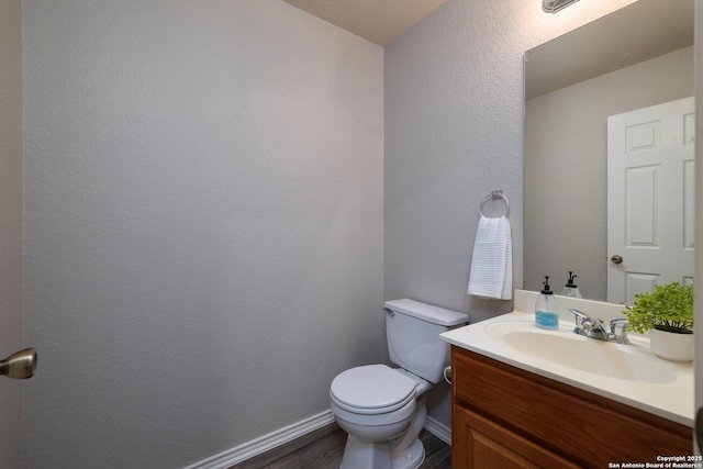 9915 Mustang Isle, San Antonio, TX 78254 - half bath featuring vanity and wood finished floors