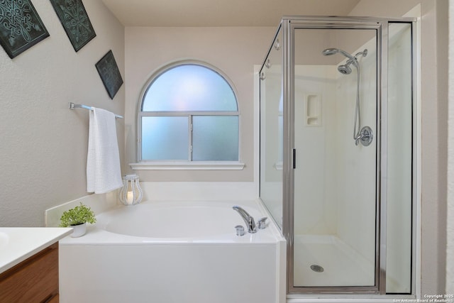9915 Mustang Isle, San Antonio, TX 78254 - bathroom with a shower stall, a bath, and vanity