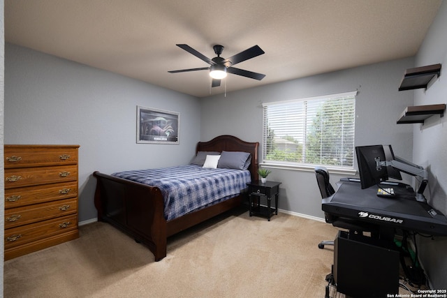 9915 Mustang Isle, San Antonio, TX 78254 - bedroom featuring light colored carpet, an office area, and a ceiling fan