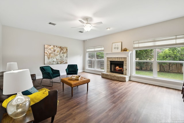18310 Redwood Path, San Antonio, TX 78259 - living room with wood finished floors, ceiling fan, and a stone fireplace