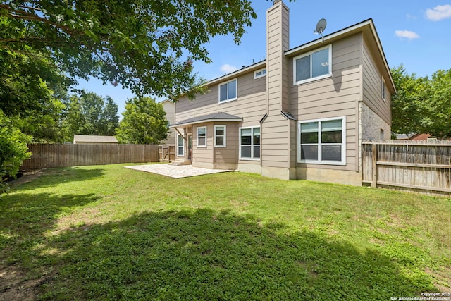 18310 Redwood Path, San Antonio, TX 78259 - rear view of house featuring a patio, a fenced backyard, and a chimney