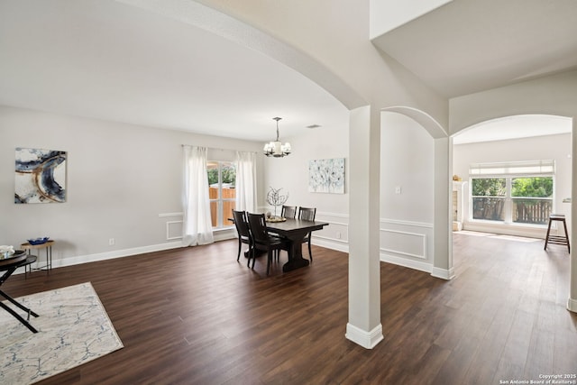18310 Redwood Path, San Antonio, TX 78259 - dining space with arched walkways, dark wood-style flooring, and a chandelier