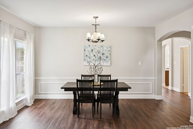 18310 Redwood Path, San Antonio, TX 78259 - dining space featuring arched walkways, a chandelier, and dark wood-type flooring