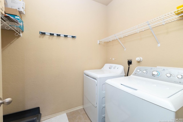 451 Tequila Rnch, San Antonio, TX 78245 - laundry area with washer and dryer and light tile patterned floors