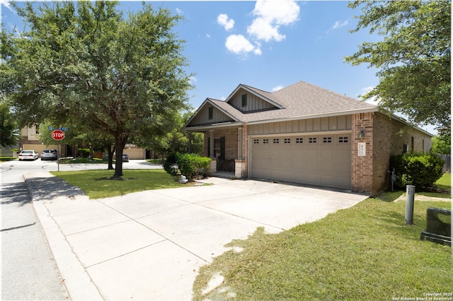 451 Tequila Rnch, San Antonio, TX 78245 - craftsman house featuring brick siding, an attached garage, a front lawn, driveway, and roof with shingles