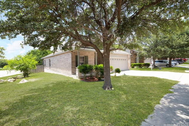 451 Tequila Rnch, San Antonio, TX 78245 - view of front of house with brick siding, driveway, and a garage