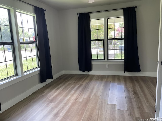 603 Humboldt, San Antonio, TX 78211 - empty room with wood finished floors and baseboards